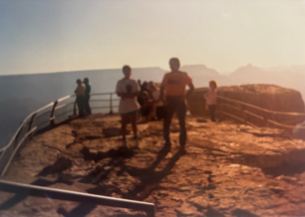 People at a scenic overlook at Grand Canyon National Park
